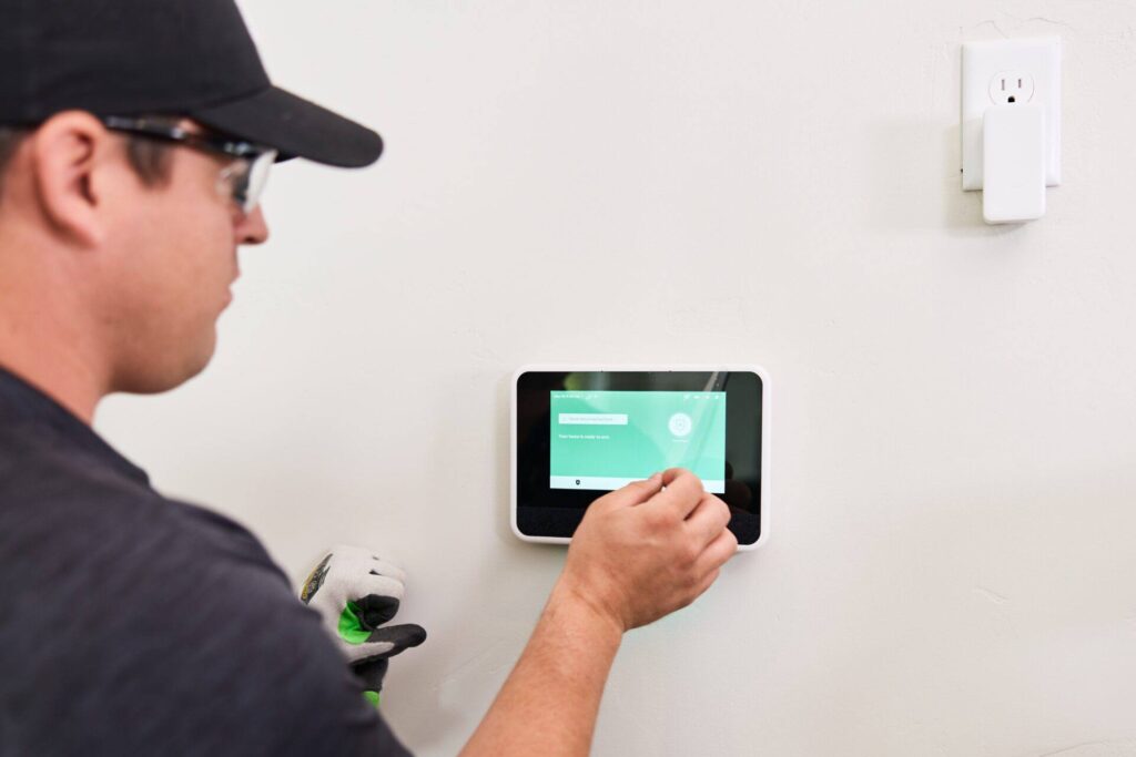 Technician installing a smart home device