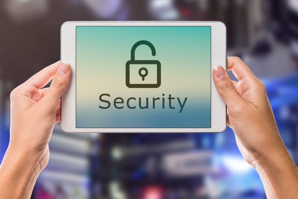 Woman holding an iPad with the word “security” on the screen with an animated lock.