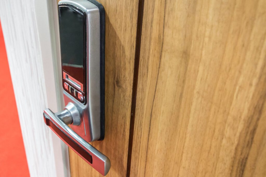 A digital lock with a touchpad on a front door.