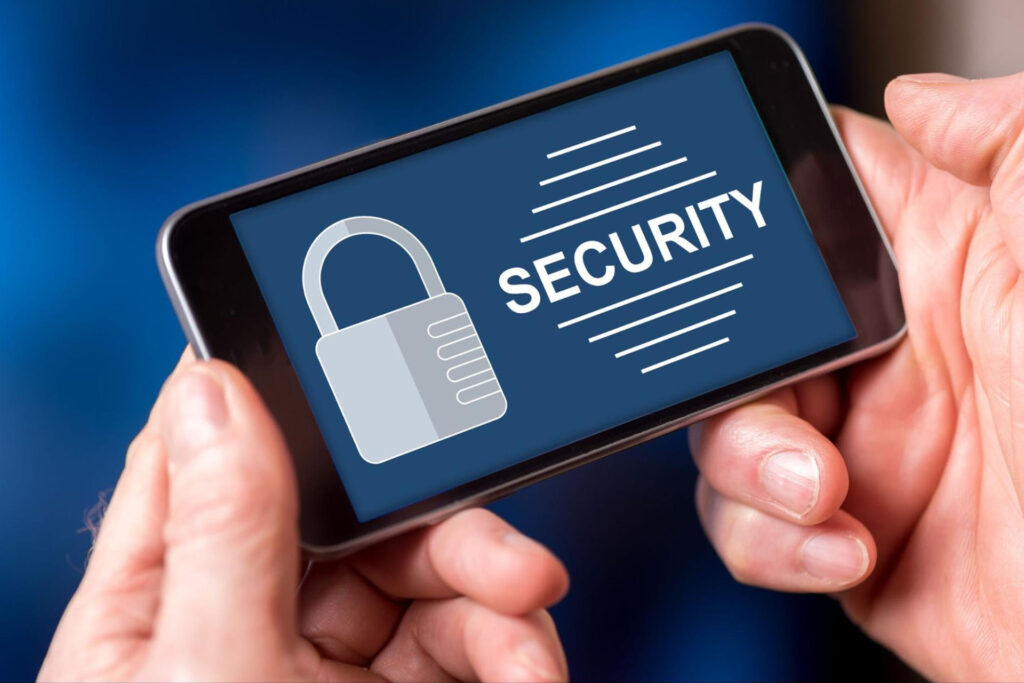 Person holding a phone with the word “security” on the screen and an animated lock.