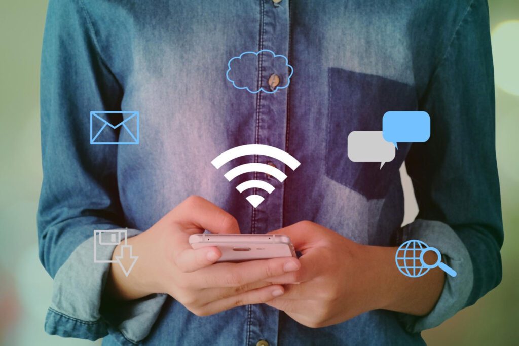 Woman using a phone to access Wi-Fi and internet applications.