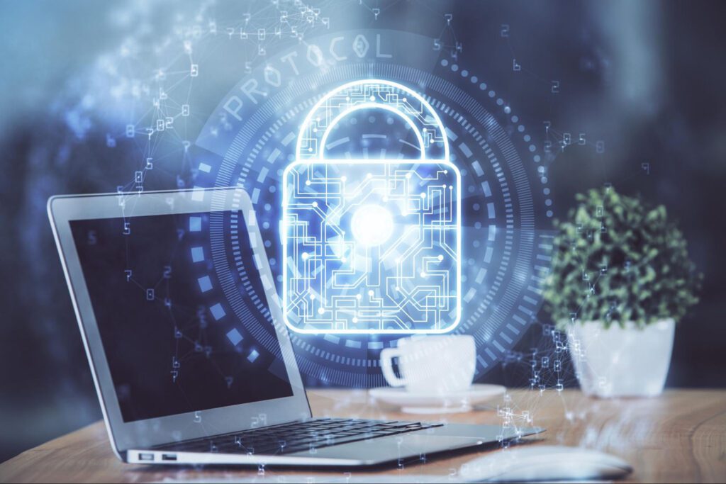 An image of a laptop on a desk with a glowing blue lock superimposed.