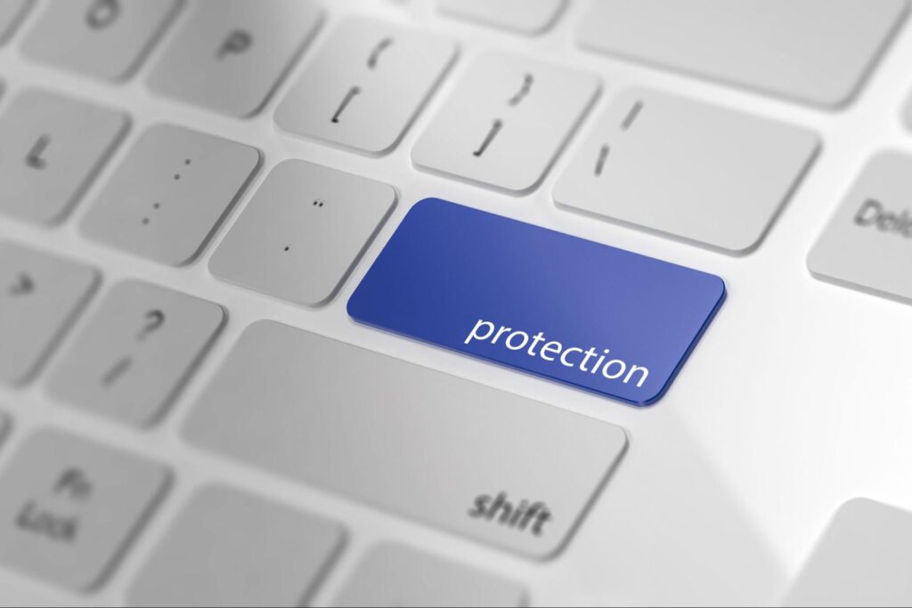 Word “protection” written on the enter key of a keyboard.