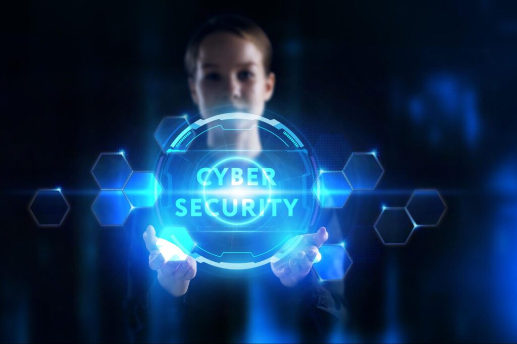 An image of a businesswoman with “Cyber Security” written in glowing blue font.