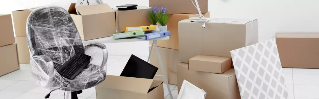 computer near moving boxes