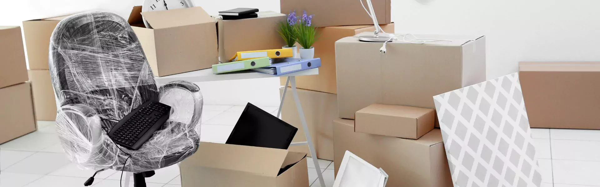 computer near moving boxes
